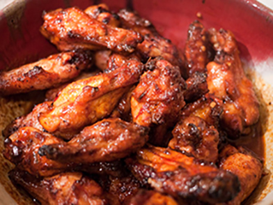 Memphis Style St. Louis Chicken Wings - Our slow smoked chicken served Memphis style (dry rub seasoning only, no sauce) or wet (with our house BBQ sauce).